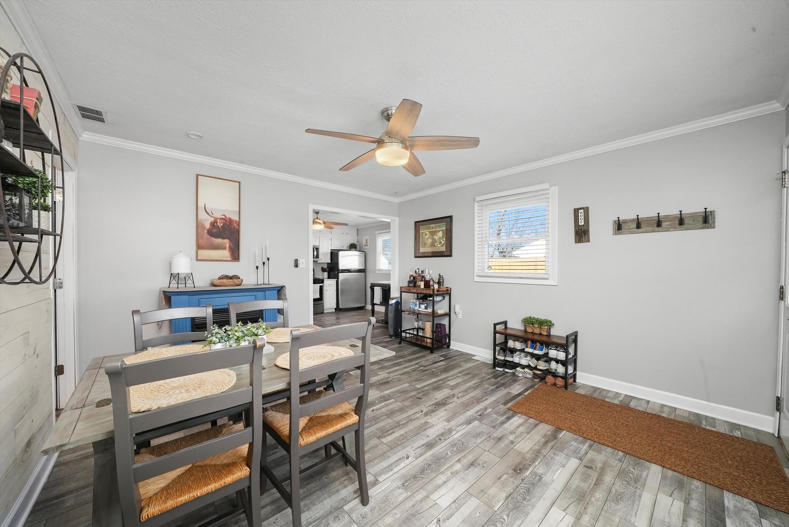 3908 Owl Drive Rolling Meadows, IL 60008 - Photo 15 of 36 a living room with furniture a chandelier and a window