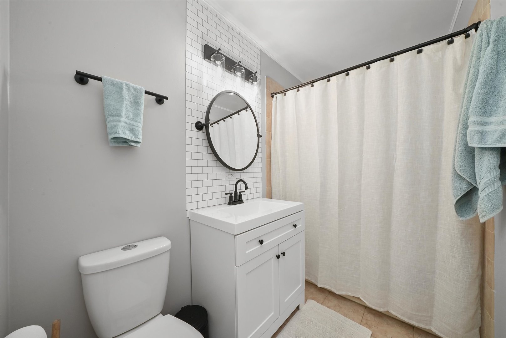 3908 Owl Drive Rolling Meadows, IL 60008 - Photo 23 of 36 a bathroom with a toilet sink and mirror