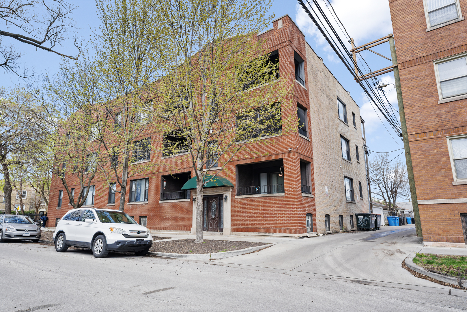 a front view of a building with parking