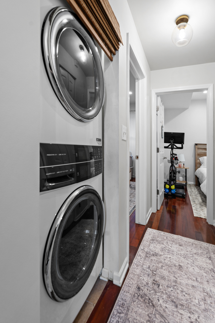 3918 West Roscoe Street, Unit 2 Chicago, IL 60618 - Photo 15 of 19 a view of a bedroom with washer and dryer