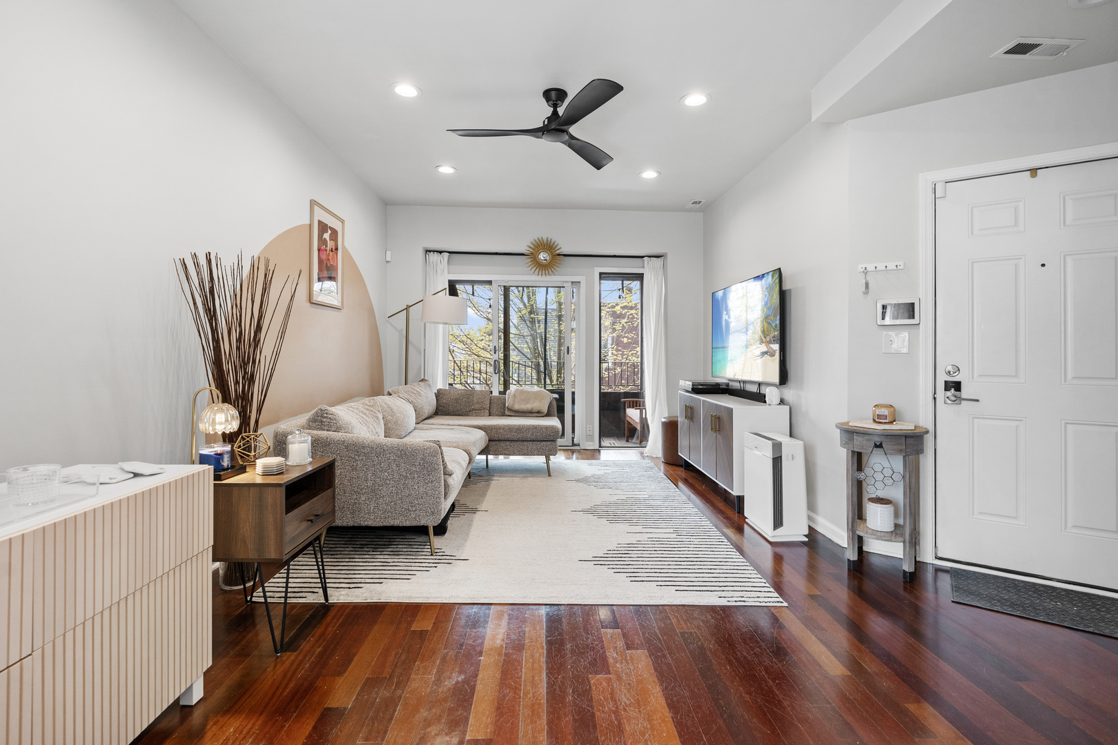 3918 West Roscoe Street, Unit 2 Chicago, IL 60618 - Photo 2 of 19 a living room with furniture and a wooden floor