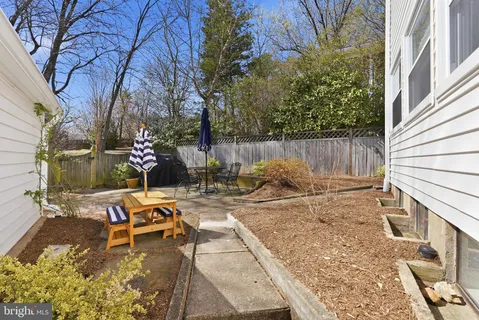 a view of a backyard with sitting area