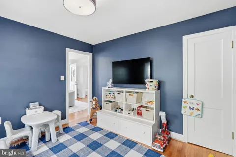 a room with furniture and a flat screen tv