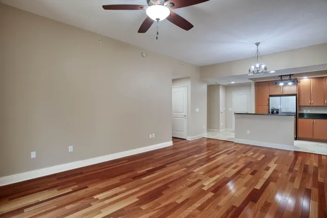 a view of a livingroom with furniture and floor to ceiling window