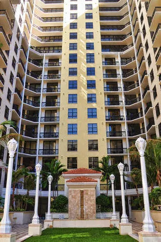 a view of a lake with couches chairs