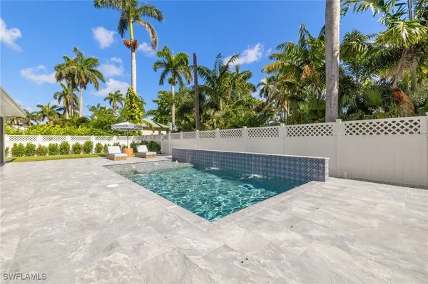 a view of a backyard with a patio