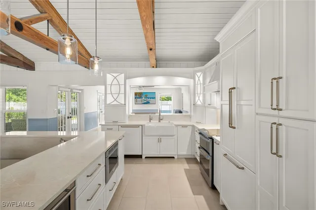 a spacious bedroom with a bed a couch and a window with the outer view