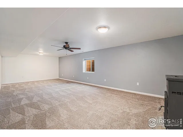 a view of an empty room and wooden floor