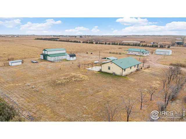 a view of a livingroom with a ceiling fan and window