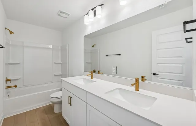 a front view of a house with large windows