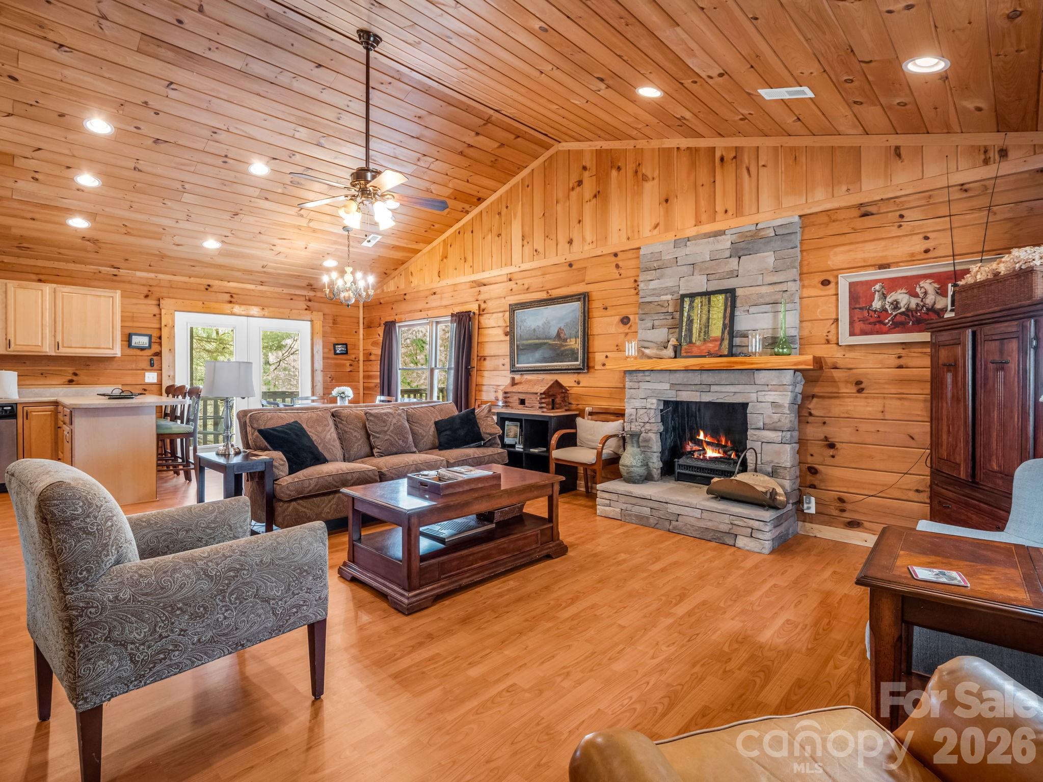 1050 Cross Ridge Drive Rutherfordton, NC 28139 - Photo 13 of 48 a living room with furniture a fireplace and a table
