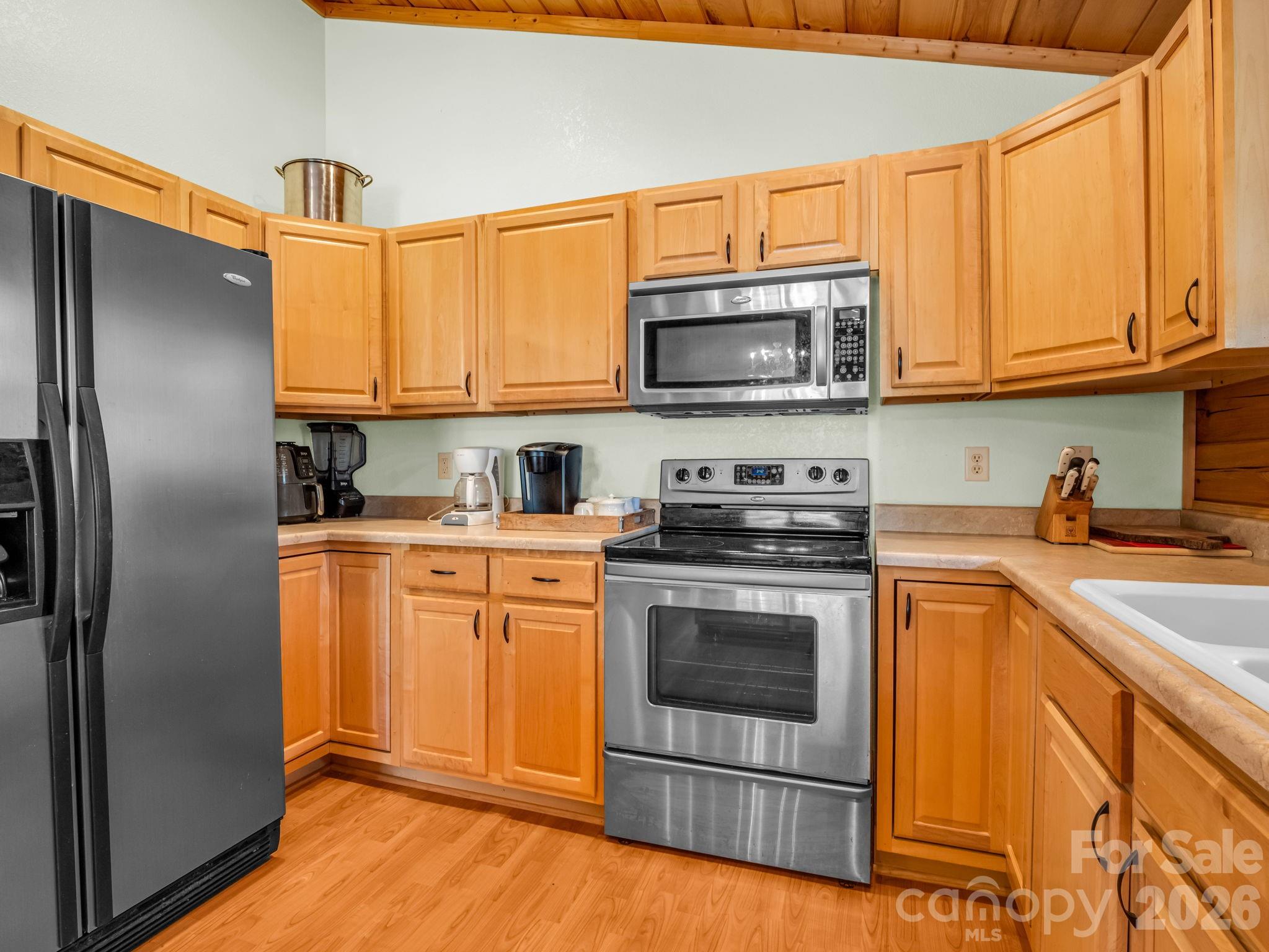 1050 Cross Ridge Drive Rutherfordton, NC 28139 - Photo 18 of 48 a kitchen with stainless steel appliances granite countertop a refrigerator stove top oven a sink and dishwasher