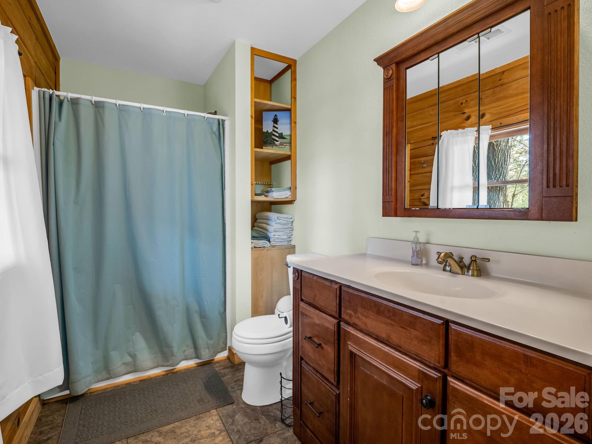 1050 Cross Ridge Drive Rutherfordton, NC 28139 - Photo 23 of 48 a bathroom with a sink a toilet and a shower