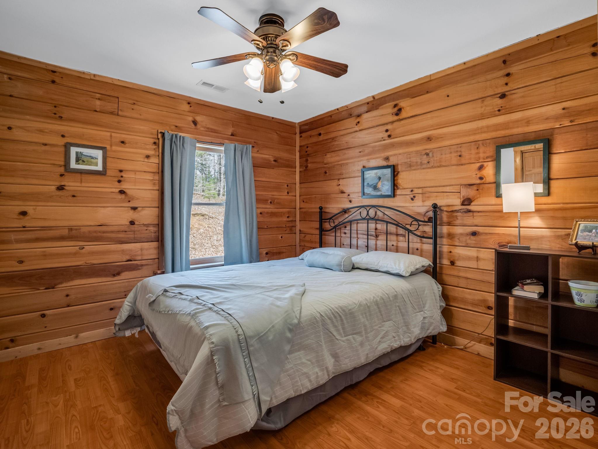 1050 Cross Ridge Drive Rutherfordton, NC 28139 - Photo 24 of 48 a bedroom with a bed and dresser with wooden floor