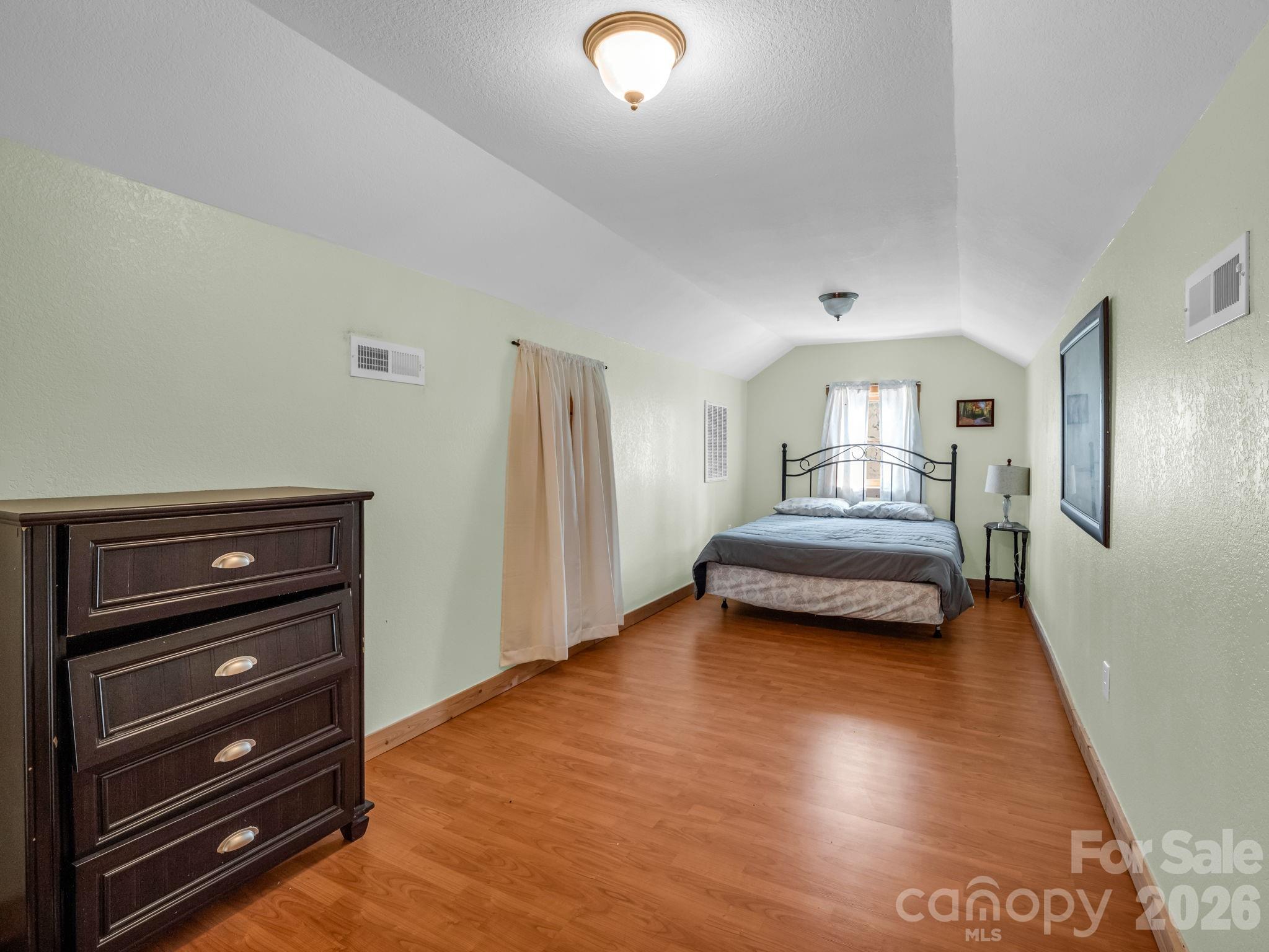 1050 Cross Ridge Drive Rutherfordton, NC 28139 - Photo 29 of 48 a view of bedroom and bedroom with wooden floor