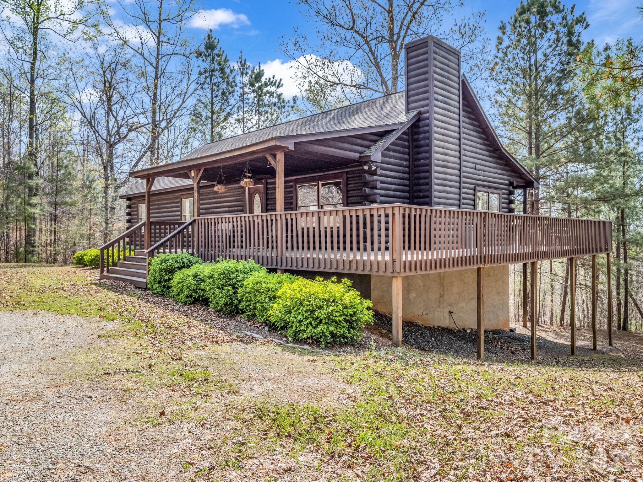 1050 Cross Ridge Drive Rutherfordton, NC 28139 - Photo 3 of 48 a front view of a house with a garden
