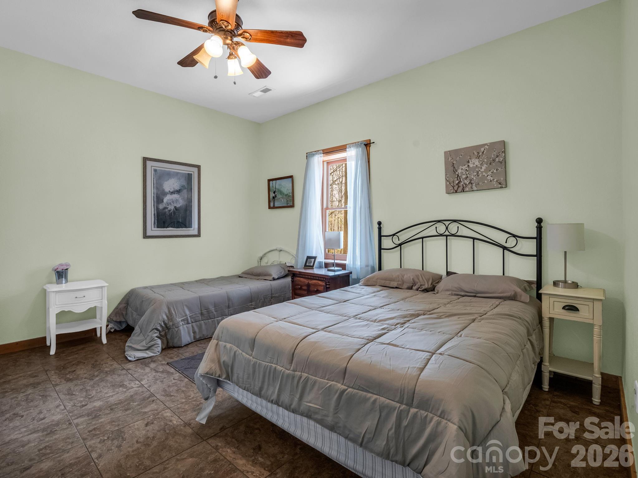 1050 Cross Ridge Drive Rutherfordton, NC 28139 - Photo 37 of 48 a bedroom with two beds and ceiling fan