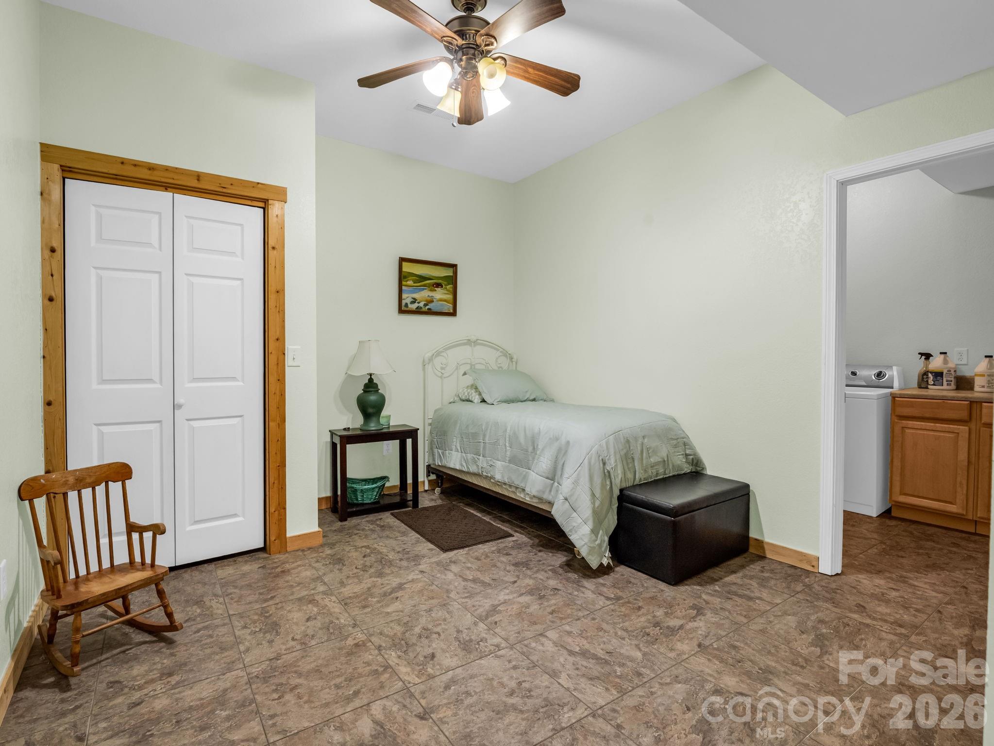 1050 Cross Ridge Drive Rutherfordton, NC 28139 - Photo 41 of 48 a bedroom with a bed and a chandelier
