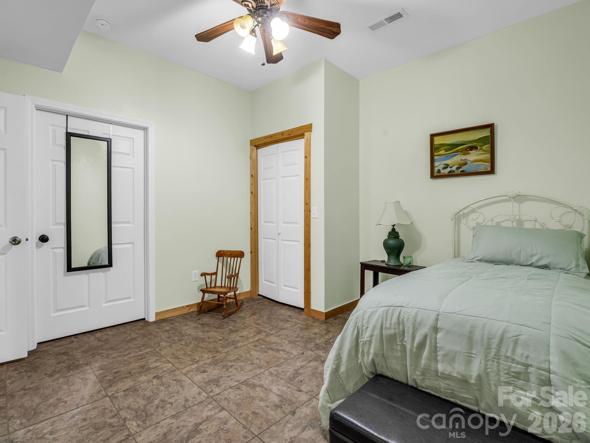 1050 Cross Ridge Drive Rutherfordton, NC 28139 - Photo 42 of 48 a bedroom with a bed and a chandelier