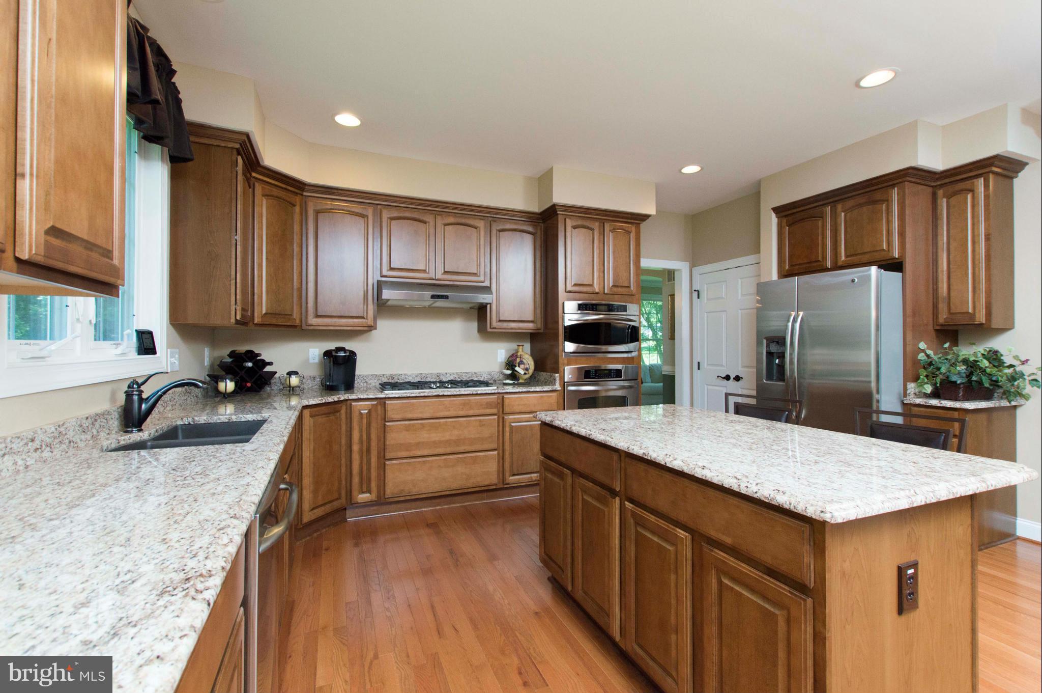 2320 Pleasantville Road Fallston, MD 21047 - Photo 11 of 30 a kitchen with stainless steel appliances granite countertop a sink refrigerator and microwave