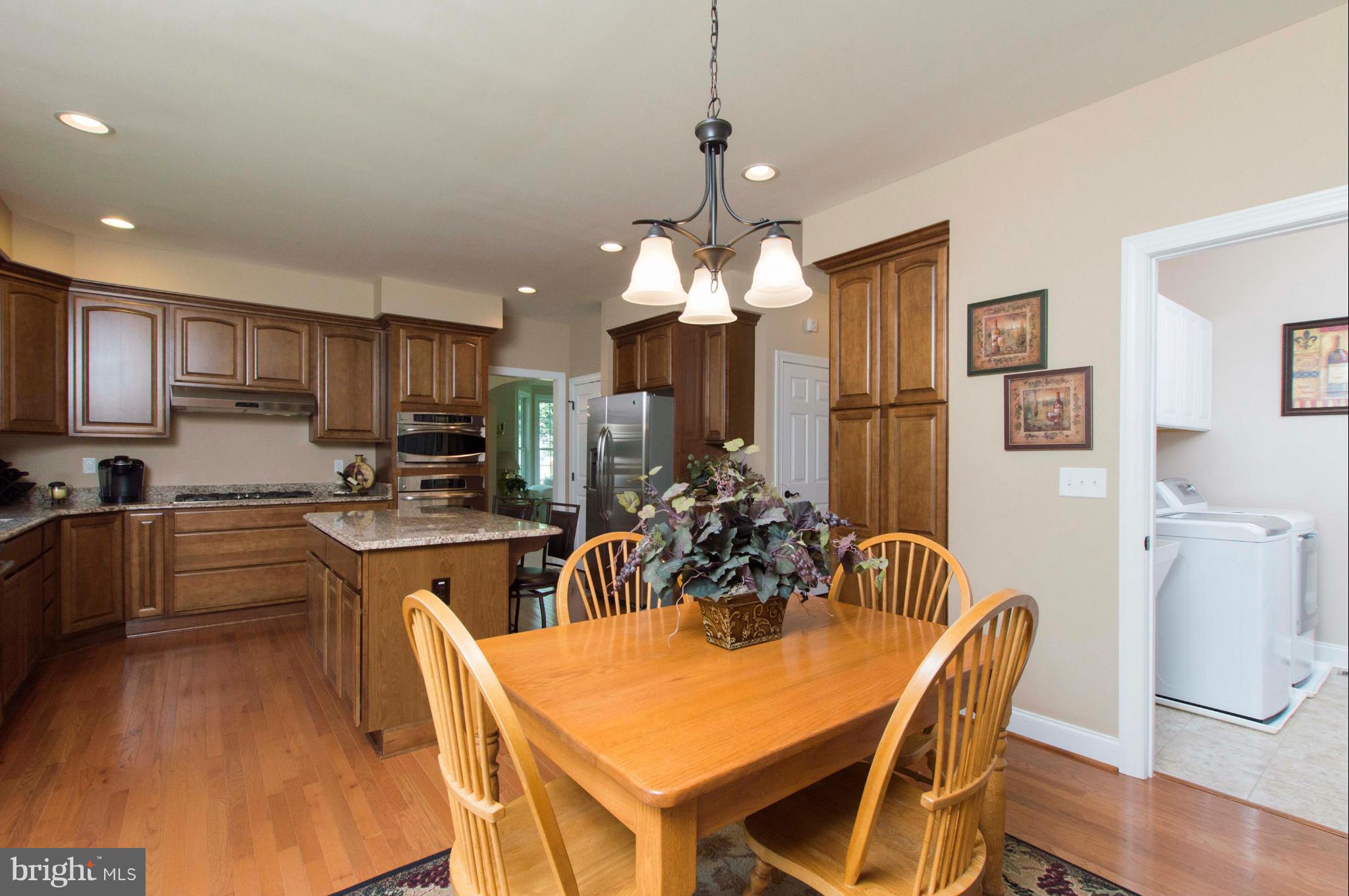 2320 Pleasantville Road Fallston, MD 21047 - Photo 13 of 30 a view of a dining room with furniture and wooden floor
