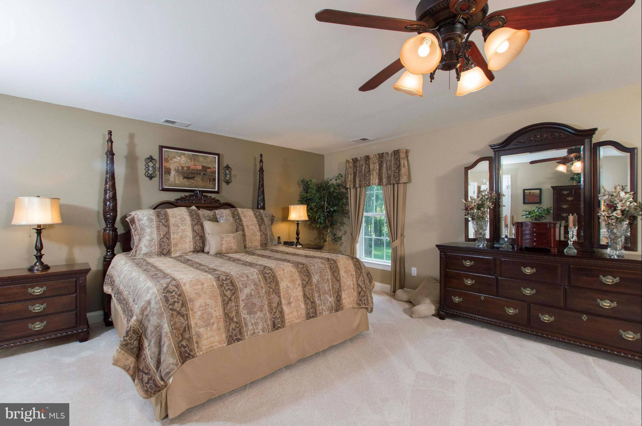 2320 Pleasantville Road Fallston, MD 21047 - Photo 16 of 30 a bedroom with a bed and a chandelier