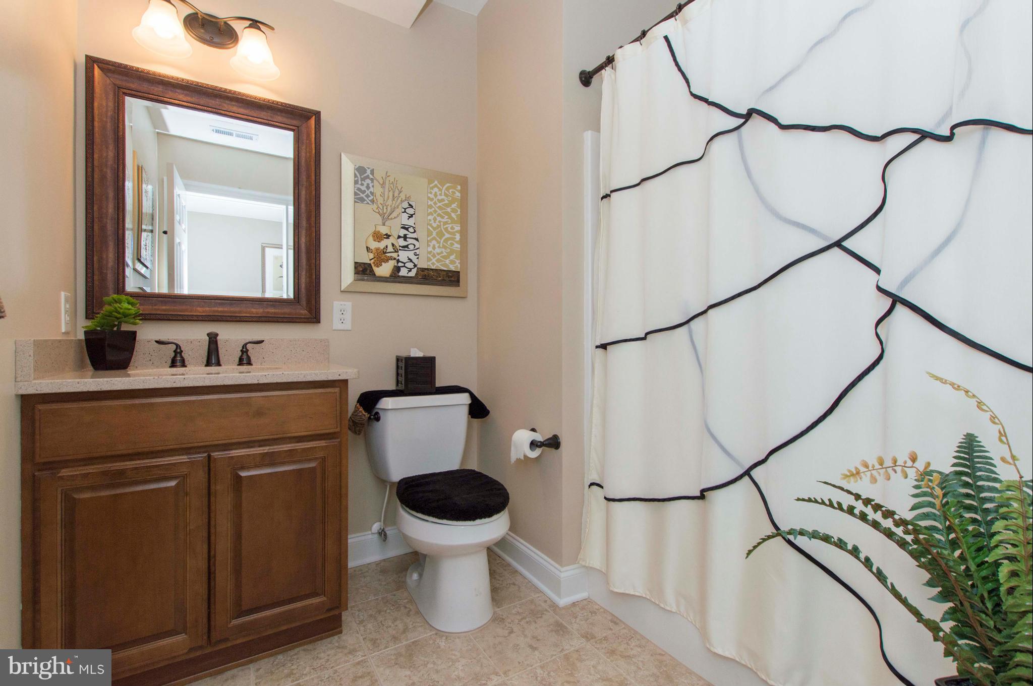 2320 Pleasantville Road Fallston, MD 21047 - Photo 26 of 30 a bathroom with a sink toilet and a mirror