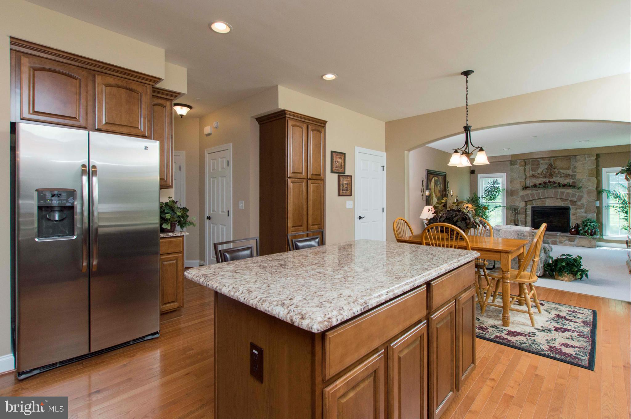 2320 Pleasantville Road Fallston, MD 21047 - Photo 10 of 30 a kitchen with stainless steel appliances granite countertop kitchen island a refrigerator and a stove top oven