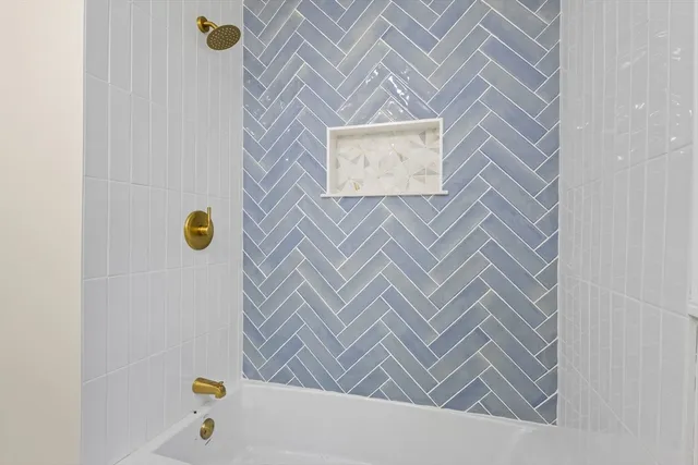 a view of an empty room and wooden floor