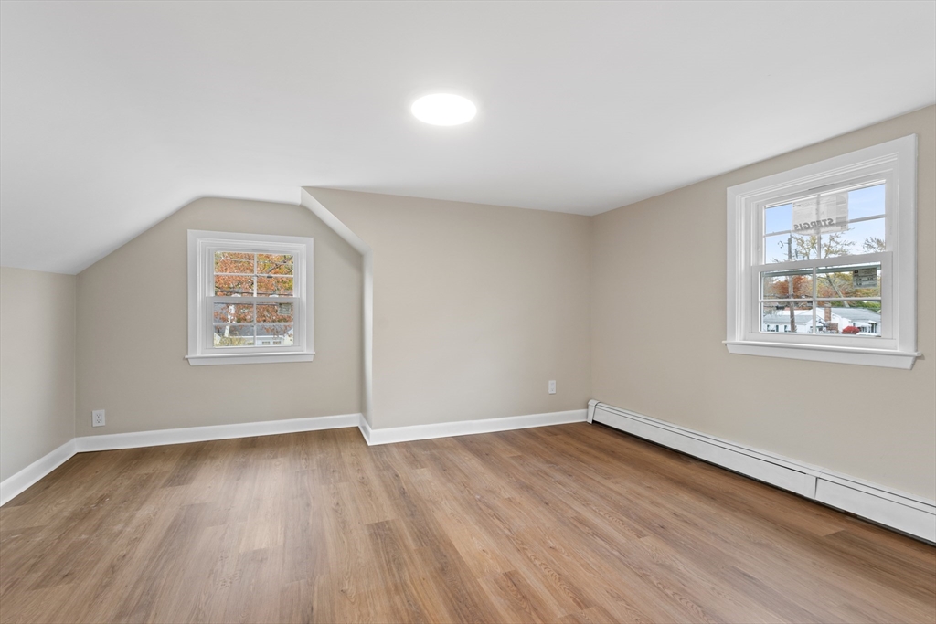 63 Hope Street Attleboro, MA 02703 - Photo 14 of 27 an empty room with wooden floor and windows