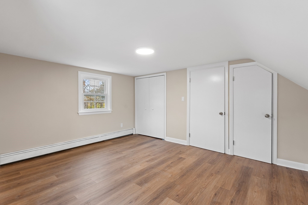 63 Hope Street Attleboro, MA 02703 - Photo 15 of 27 a view of an empty room with wooden floor and a window