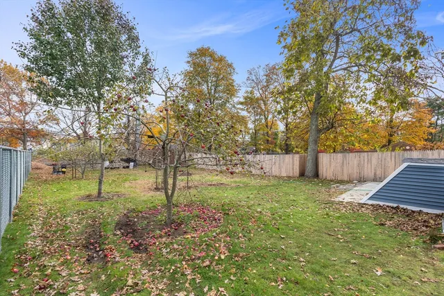 a backyard of a house with lots of green space