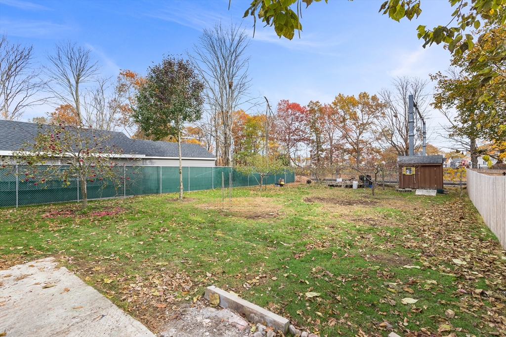 63 Hope Street Attleboro, MA 02703 - Photo 25 of 27 a backyard of a house with lots of green space