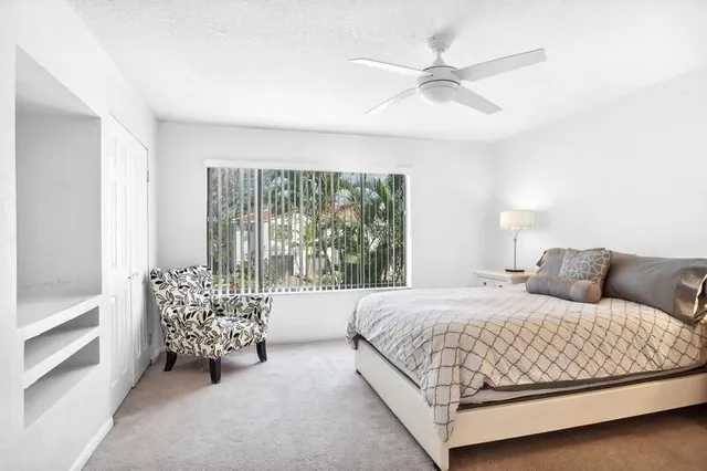 a view of yard with swimming pool and green space