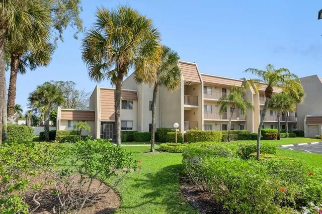 a living room with couch and a chandelier