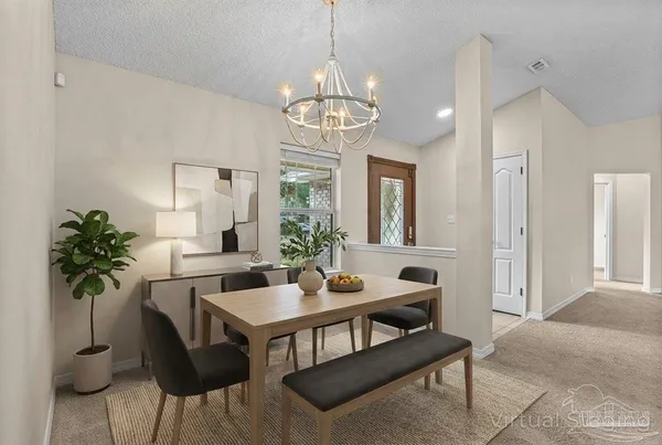 a view of livingroom with hardwood floor and a kitchen view