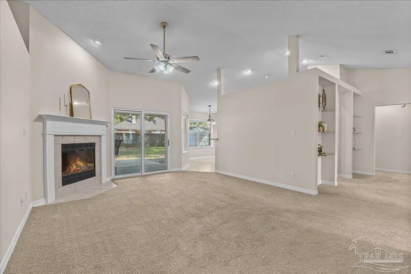 a living room with furniture and a fireplace