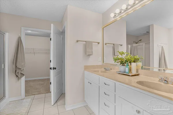a white bath tub sitting next to a shower