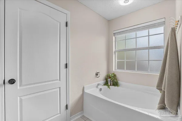a bathroom with a glass shower door and a bathroom