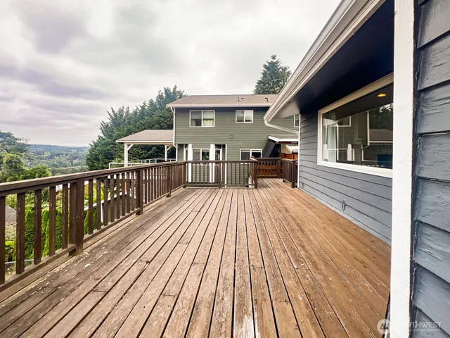 a view of a house with wooden deck