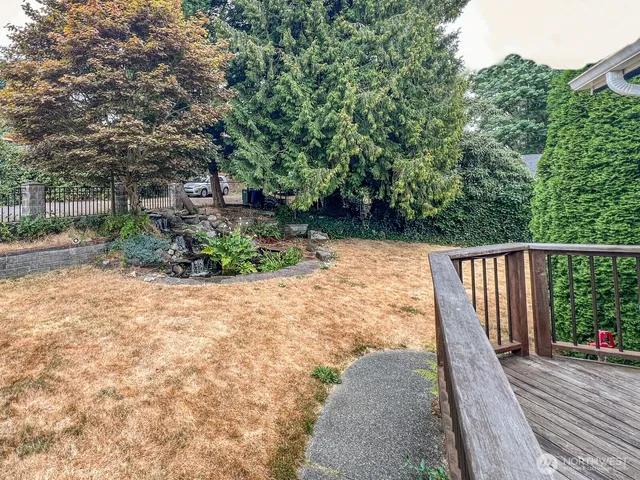a view of a balcony with wooden floor