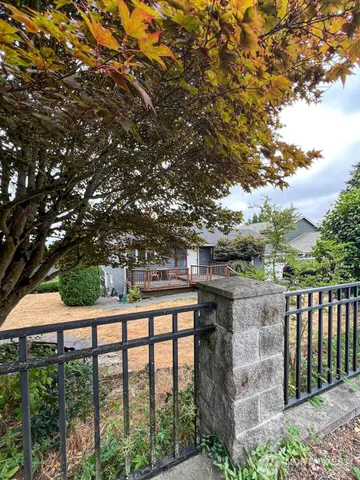 a balcony with trees in front of it