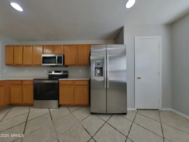 a view of an empty room and a windows