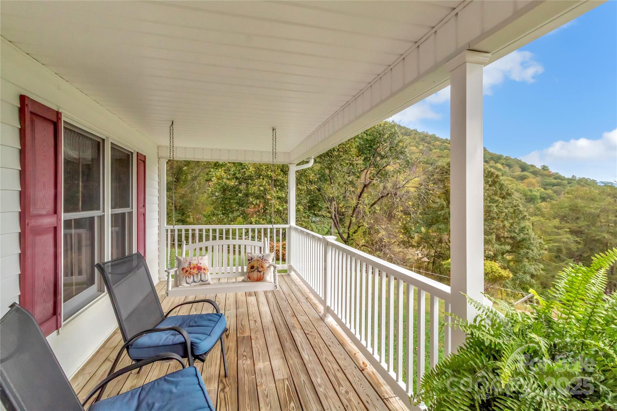 580 River Point Road Canton, NC 28716 - Photo 14 of 46 a view of a balcony with chair