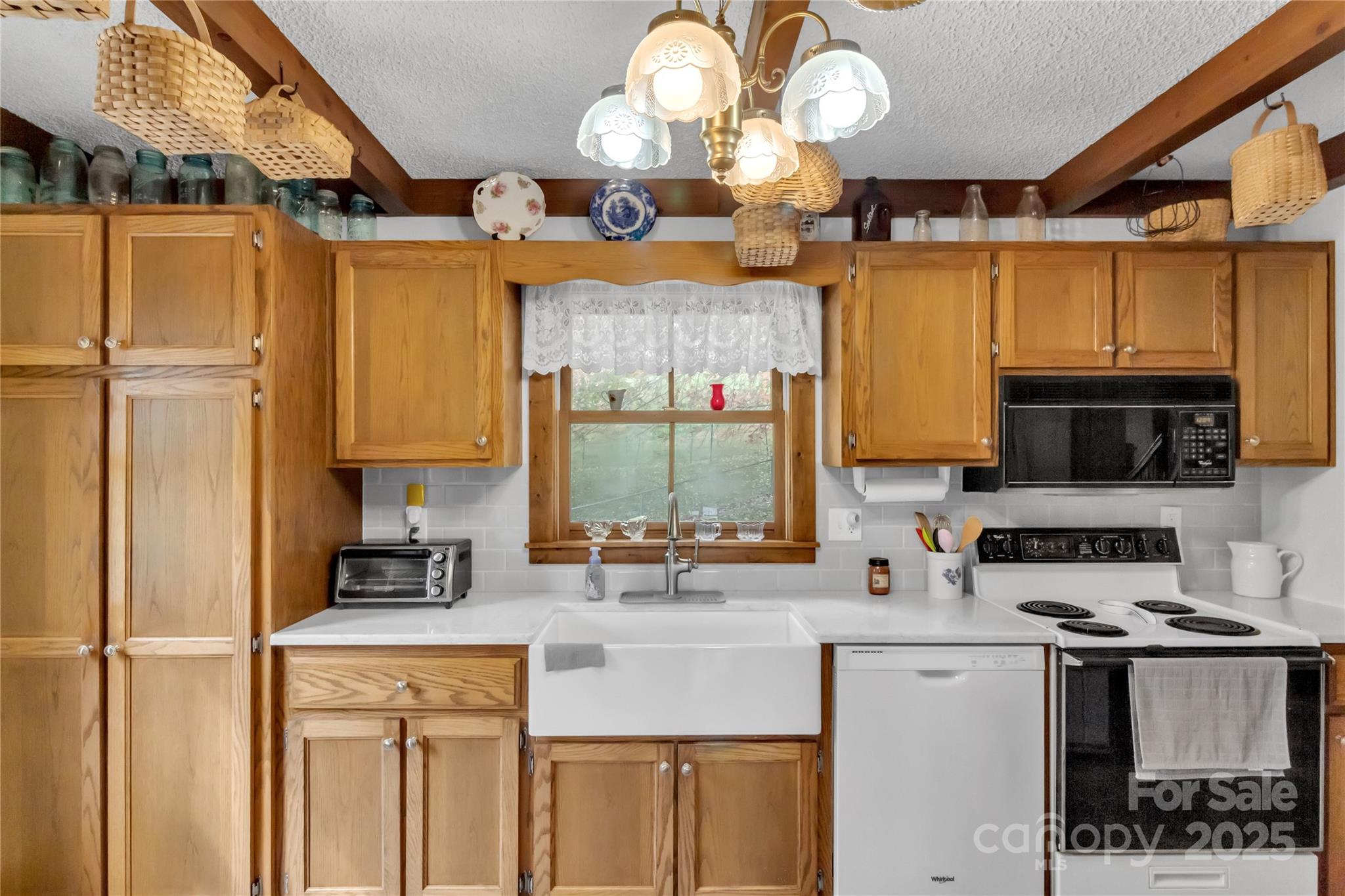 580 River Point Road Canton, NC 28716 - Photo 19 of 46 a kitchen with cabinets a center island stainless steel appliances and furniture