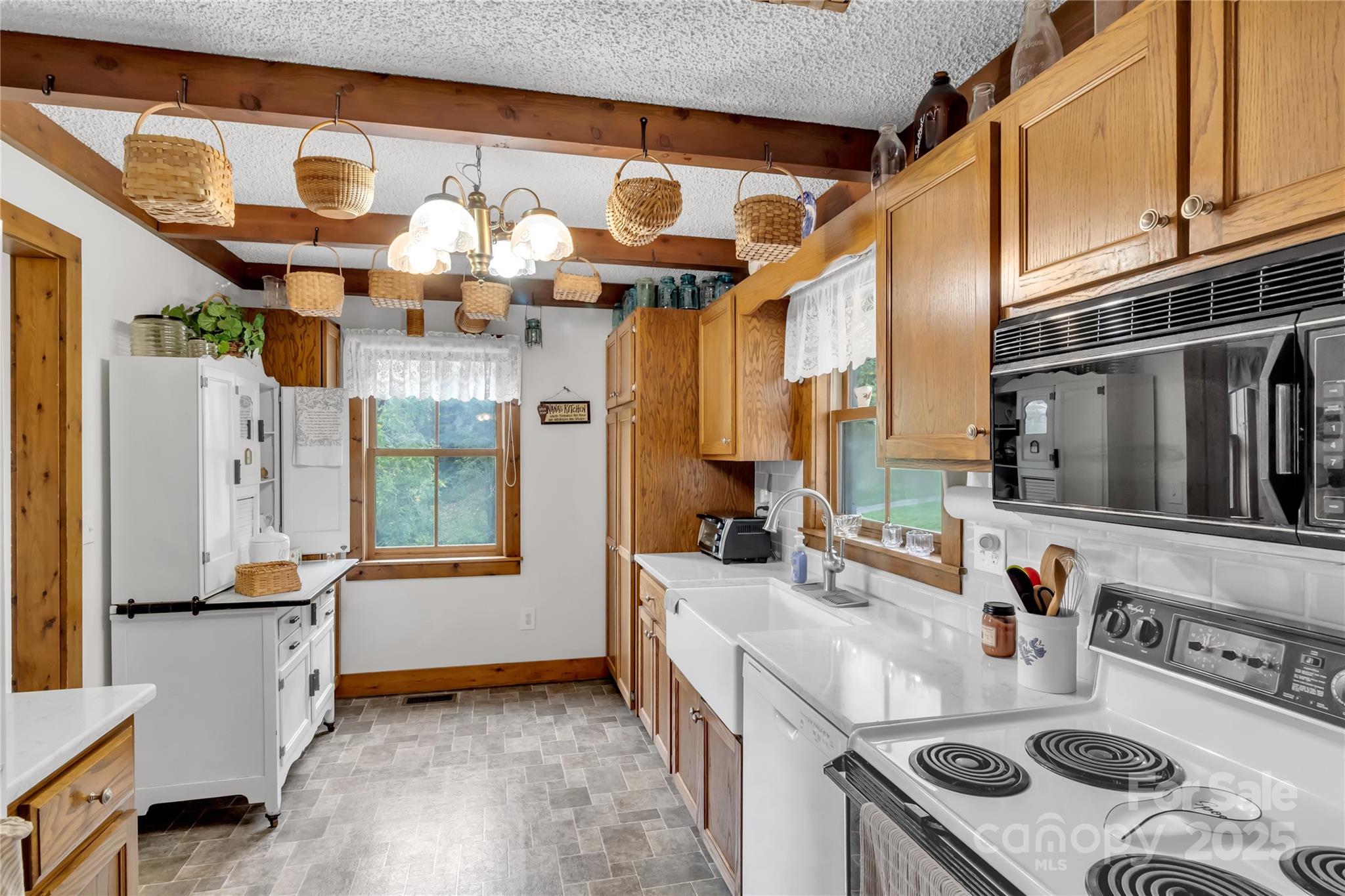 580 River Point Road Canton, NC 28716 - Photo 20 of 46 a kitchen with stainless steel appliances granite countertop a sink stove and refrigerator