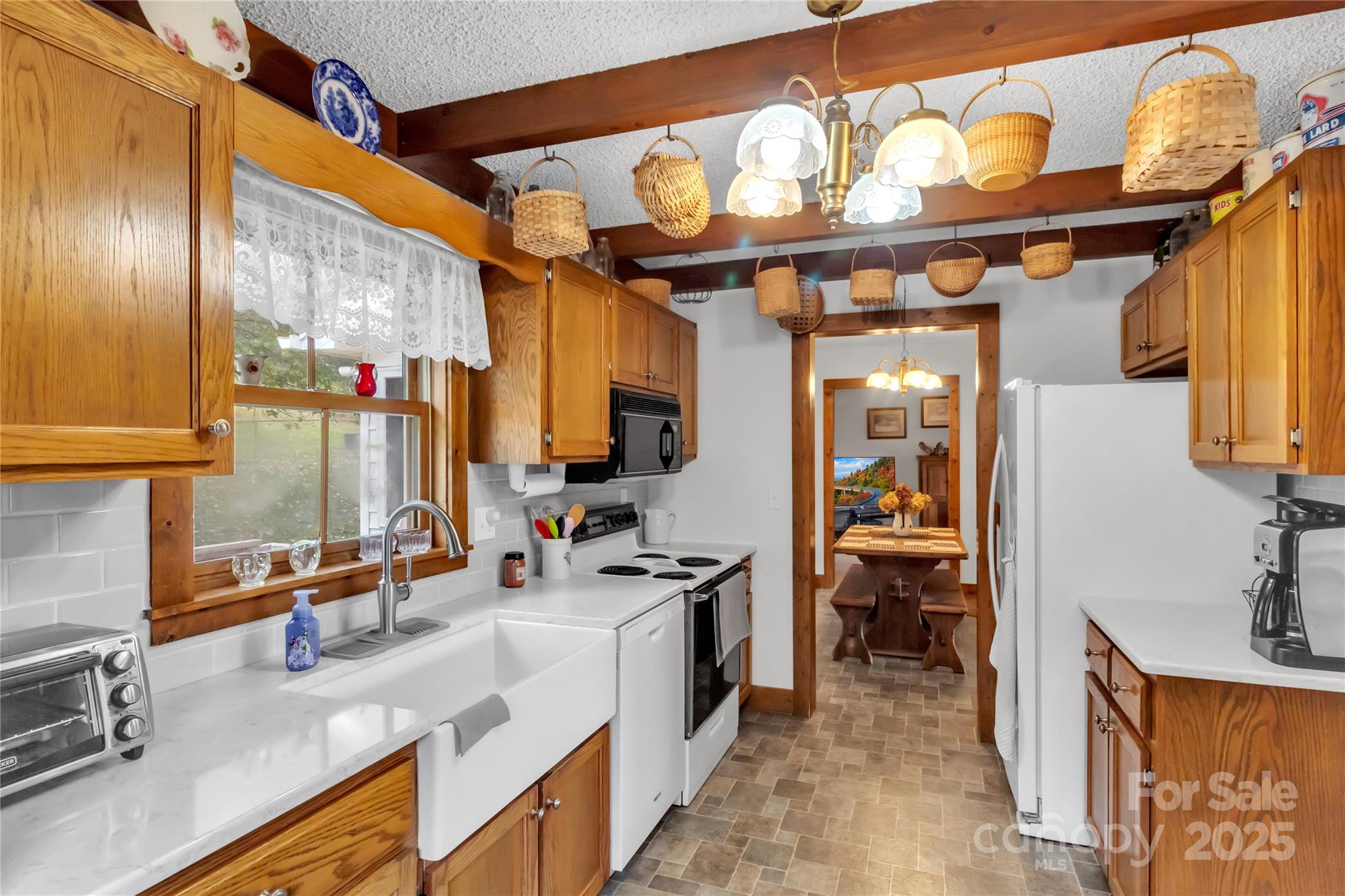 580 River Point Road Canton, NC 28716 - Photo 21 of 46 a kitchen with stainless steel appliances a sink and a refrigerator
