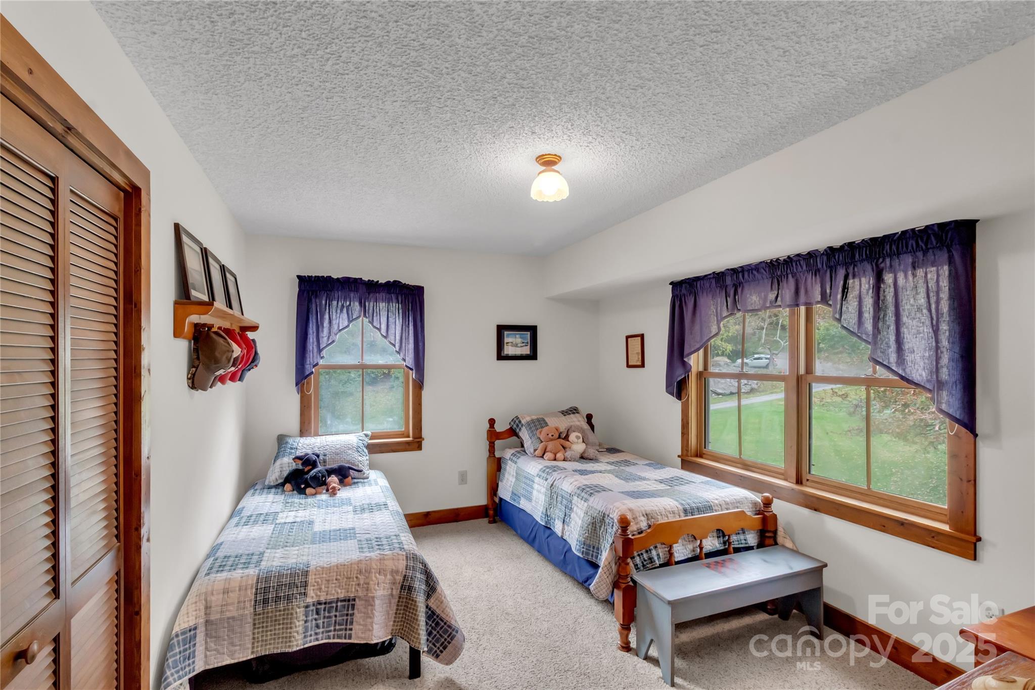 580 River Point Road Canton, NC 28716 - Photo 31 of 46 a bedroom with bed and a window