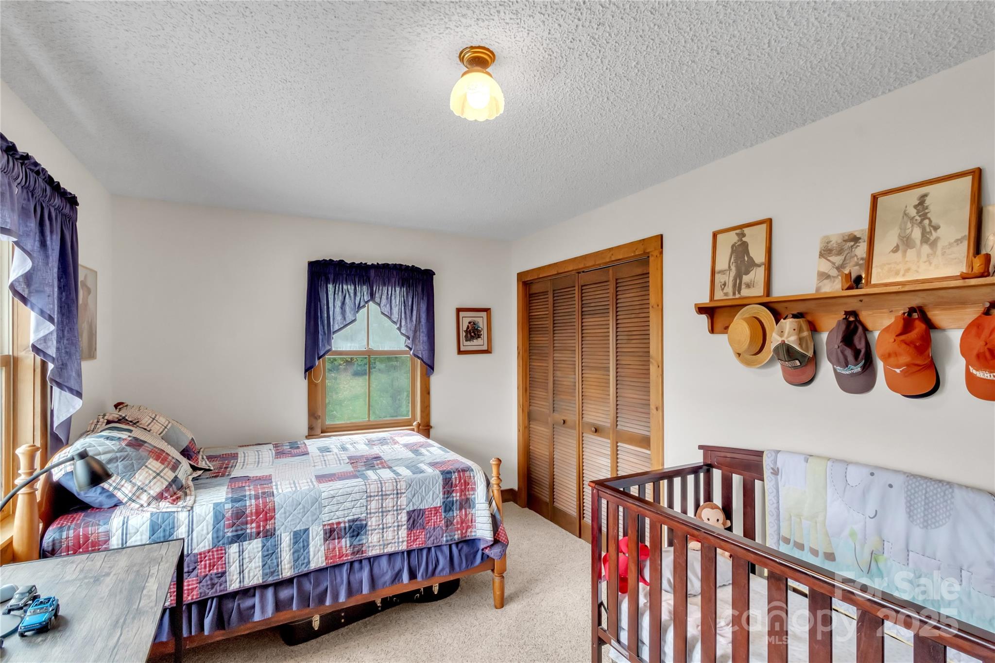 580 River Point Road Canton, NC 28716 - Photo 35 of 46 a bedroom with a bed and a window