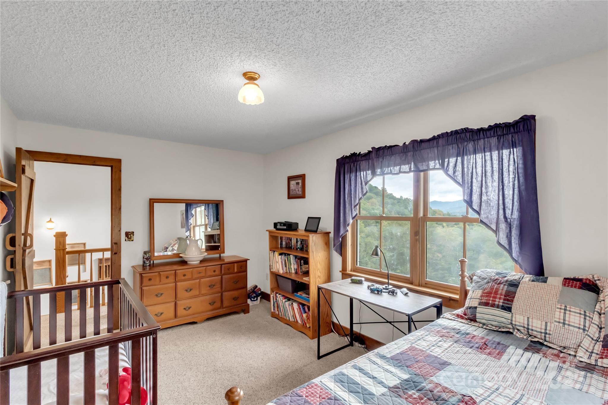 580 River Point Road Canton, NC 28716 - Photo 36 of 46 a living room with furniture and large windows